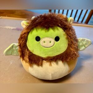 Desmund the Dragon squishmallow in a lion costume